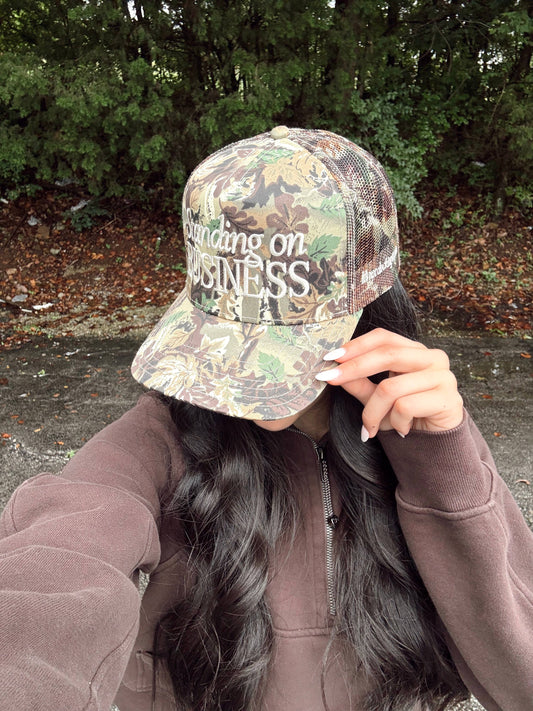 Standing on Business Trucker Hat