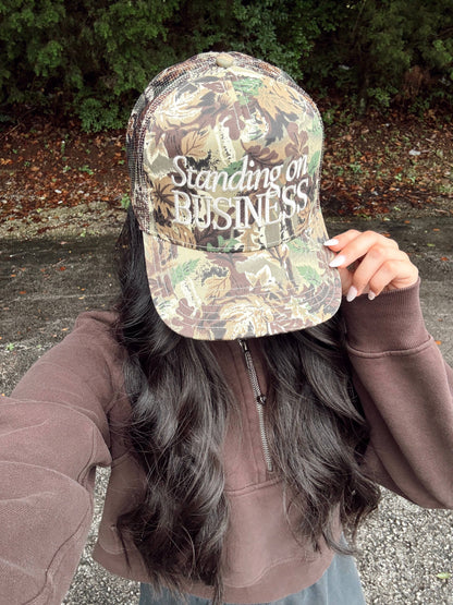 Standing on Business Trucker Hat
