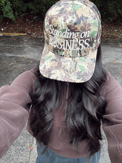 Standing on Business Trucker Hat