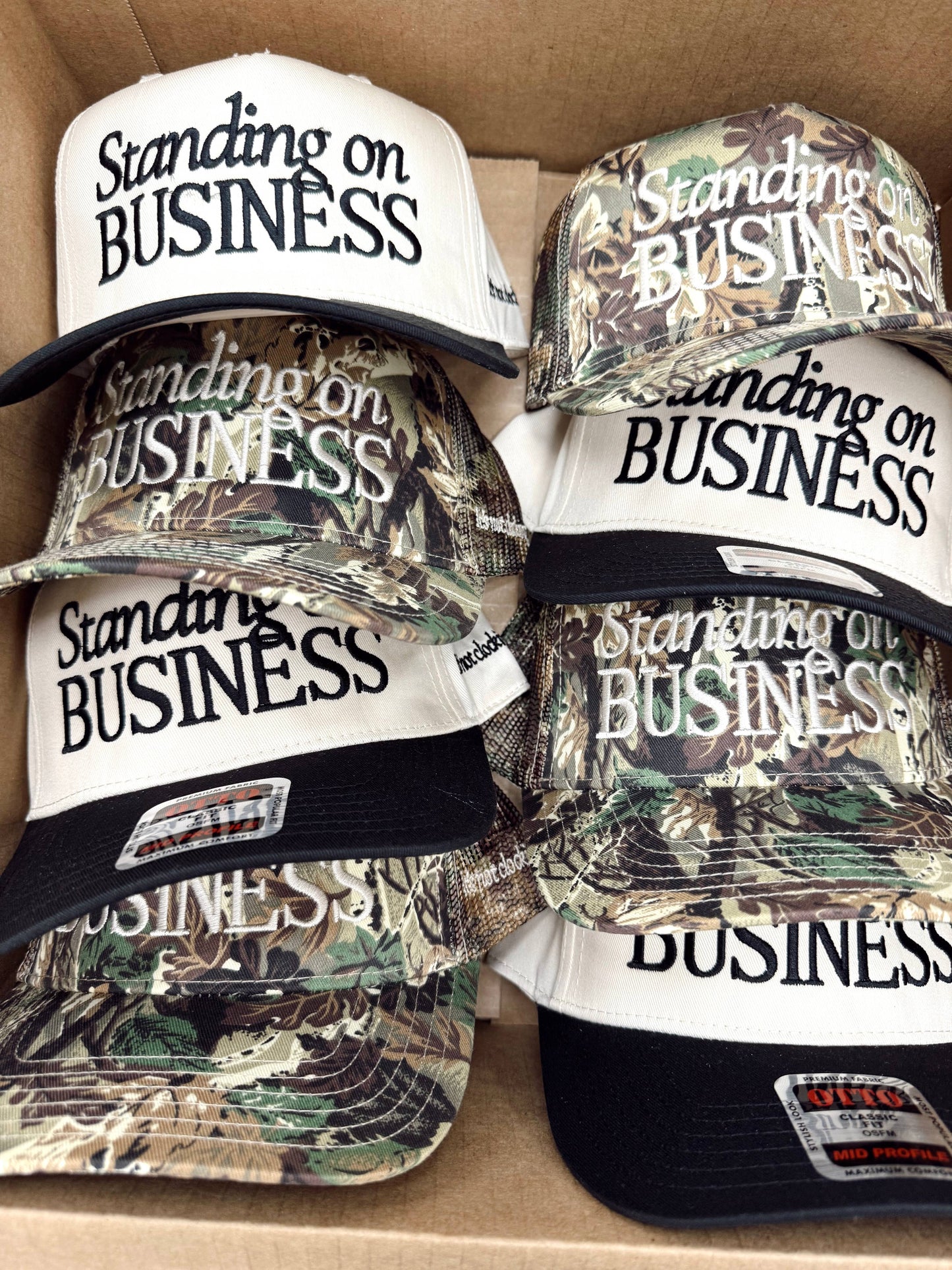 Standing on Business Trucker Hat