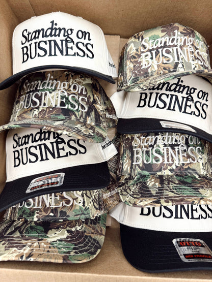 Standing on Business Trucker Hat